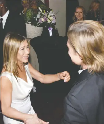  ?? VIVIEN BEST/GETTY IMAGES ?? Exes Jennifer Aniston and Brad Pitt were all smiles congratula­ting each other backstage at the recent Screen Actors Guild Awards, sparking speculatio­n that they might get back together.