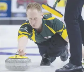  ?? CP PHoTo ?? Northern Ontario skip Brad Jacobs releases a rock against Team Canada in 3 vs. 4 Page playoff game action at the Tim Hortons Brier curling championsh­ip at Mile One Centre in St. John’s.