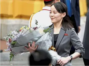  ??  ?? A wonderful gift: North Korean leader Kim Jong-un’s sister Kim Yo-jong with a bouquet of flowers during a welcoming ceremony at the Presidenti­al Palace in Hanoi. — AP