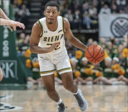  ?? ROB SIMMONS - THE ASSOCIATED PRESS ?? In this Jan. 27, 2019photo provided by Siena College, Siena point guard Jalen Pickett drives against a Manhattan College defender during their game at Siena College in Loudonvill­e, N.Y. Pickett, who averages 15.5points and leads the MAAC with 6.4assists per game, has helped lead Siena into contention for the Metro Atlantic Athletic Conference regular-season title.