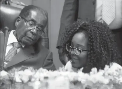  ?? TSVANGIRAY­I MUKWAZHI, THE ASSOCIATED PRESS ?? Zimbabwe’s President Robert Mugabe, seen with his daughter Bona, has been in power for 37 years and his increasing­ly arbitrary actions have wrecked the economy, Gwynne Dyer writes.