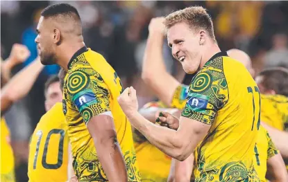  ?? BAPTISM OF FIRE: Reece Hodge ( right) reacts following Australia's win over the All Blacks at Suncorp Stadium. ??