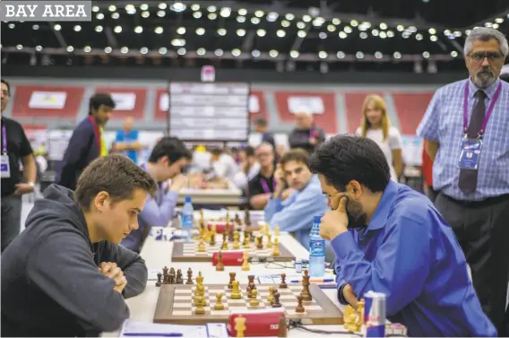  ?? Oleksandr Rupeta / NurPhoto ?? The U.S. chess team plays Canada in the last round of the 42nd Chess Olympiad in Azerbaijan on Sept. 13. Team USA was undefeated with nine wins and two draws.