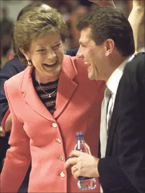  ?? Wade Payne / Associated Press ?? Tennessee coach Pat Summitt, left, and UConn coach Geno Auriemma share a laugh before their game in 2002 in Knoxville, Tenn. Auriemma is on the verge of catching Summitt on the all-time wins list.