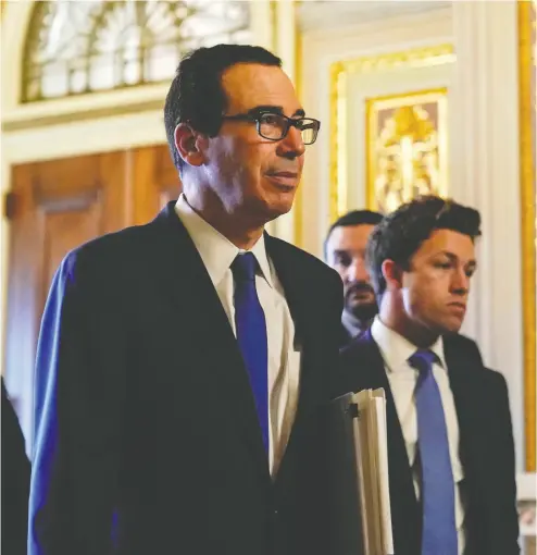  ?? JOSHUA ROBERTS / REUTERS ?? U.S. Secretary of the Treasury Steven Mnuchin walks to a meeting during negotiatio­ns on a COVID-19 relief package in Washington on Monday. David Rosenberg write’s he’s not sure the Democrats realize the seriousnes­s of the situation.