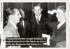  ?? ?? Propaganda­minister Joseph Goebbels (l.) beglückwün­scht im Ufa-Palast am Zoo in Berlin den Regisseur Veit Harlan (r.).