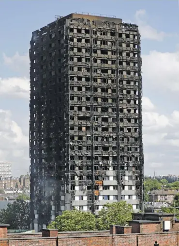  ?? (AFP) ?? This file photo shows the remains of the residentia­l block Grenfell Tower in west London on June 15, a day after it was gutted by fire