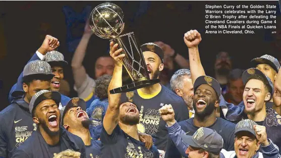  ?? AFP ?? Stephen Curry of the Golden State Warriors celebrates with the Larry O’Brien Trophy after defeating the Cleveland Cavaliers during Game 4 of the NBA Finals at Quicken Loans Arena in Cleveland, Ohio.