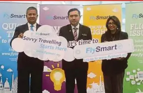  ?? PIC BY MOHD FADLI HAMZAH ?? Transport Minister Anthony Loke (centre) with Transport Ministry secretary-general Datuk Seri Saripuddin Kasim (left) and Mavcom consumer affairs director S. Pushpalath­a at the launch of FlySmart in Sepang yesterday.