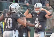  ?? KYLE TERADA, USA TODAY SPORTS ?? Raiders QB Derek Carr, right, has thrown 24 touchdown passes to five intercepti­ons and has a 100.3 passer rating.