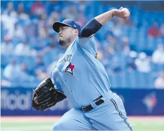  ?? THE CANADIAN PRESS ?? Toronto Blue Jays’ Hyun Jin Ryu pitches in the first inning of their game against the Detroit Tigers on Saturday. Ryu pitched seven scoreless innings.