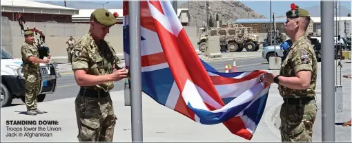  ??  ?? STANDING DOWN: Troops lower the Union Jack in Afghanista­n