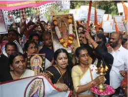  ?? — BIPLAB BANERJEE ?? Lord Ayyappa devotees take part in the “Ayyappa Namajapa Yatra” in New Delhi on Sunday against the Supreme Court verdict on the entry of women of all ages into the Sabarimala Temple.