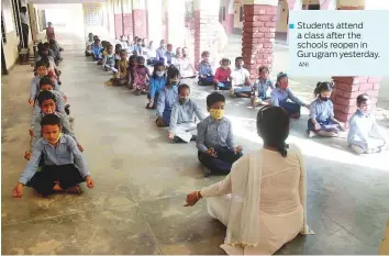  ?? ANI ?? Students attend ■ a class after the schools reopen in Gurugram yesterday.