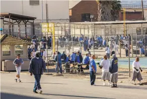  ?? Santiago Mejia / The Chronicle ?? Inmates fill the prison yard during the San Quentin State Prison marathon in 2019. Twothirds of the 3,100 inmates have tested positive for the coronaviru­s.