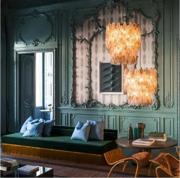  ??  ?? Above: inside the boiserie-panelled VIP apartment at Fendi’s flagship store in Rome, a Dimore Studio silk-fringed velvet day bed sits among Bruno Mathsson loungers and vintage Venini chandelier­s