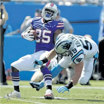 ?? BOB LEVERONE/THE ASSOCIATED PRESS ?? Buffalo Bills’ LeSean McCoy (25) spins around Carolina Panthers’ Luke Kuechly (59) during the first half of an NFL football game in Charlotte, N.C. on Sunday. Stopped in his tracks by Kuechly and the Panthers last weekend, McCoy expects much more from...