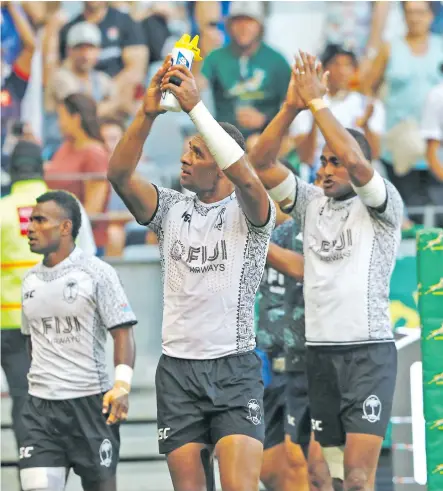  ?? Photo: Ian Muir ?? Fiji Airways Fijian 7s reps Seremaia Tuwai, Jasa Veremalua and Apisai Domolailai applaud the fans in their final match during the Cape Town 7s over the weekend.