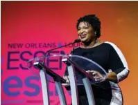  ?? AMY HARRIS/INVISION/AP ?? Democratic Georgia governor candidate Stacey Abrams speaks July 7 at the 2018 Essence Festival at the Ernest N. Morial Convention Center in New Orleans. The candidate who wins the GOP Georgia governor runoff election will face Abrams in November.