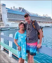  ?? SUBMITTED ?? Charlotte and Mark Strickland of Conway stand in front of the Princess Caribbean cruise ship during a stop in Jamaica. They were passengers on the ship March 1-11, but the ship was detained at sea after two crew members had to be tested for the coronaviru­s. The tests were negative. “We’re fine,” Charlotte said.