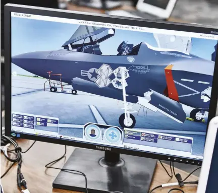  ??  ?? Learning how to virtually maintain an F-35 on the Air System Maintenanc­e Training system has boundless benefits: no costly mistakes on a £100m jet, quick and easy access through panels, and the ability to peek into gaps that your head would never fit into on the real thing LEFT