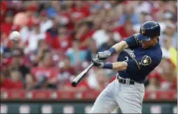  ?? GARY LANDERS ?? FILE - In this July 2, 2019, file photo, Milwaukee Brewers’ Christian Yelich hits a solo home run in Cincinnati. Josh Bell and Yelich are among eight competitor­s in this year’s All-Star Game Home Run Derby, which is handing out a $1million prize to the winner.