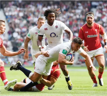  ??  ?? Eye for a gap: Ben Youngs scores against Wales