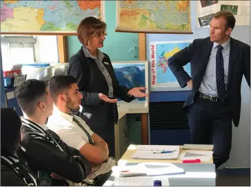  ??  ?? The minister for Education Rob Stokes (right), discusses the new course with the principal of Condell Park High School, Susie Mobayed, and senior students.