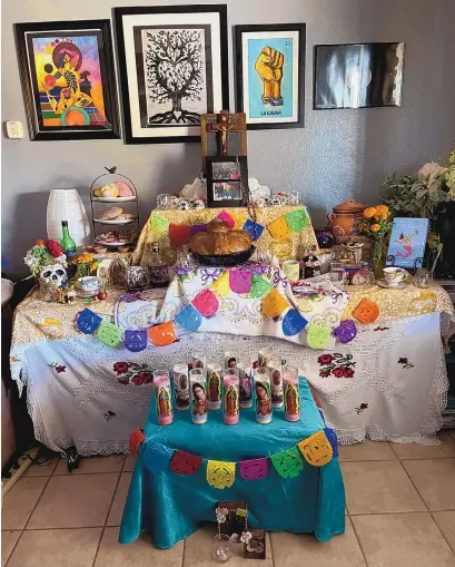  ?? PHOTOS COURTESY OF CARMEN MEDRANO ?? A seven level altar features saints, candles for each dearly departed, salt to purify the soul after long travel, items they once owned or reminders of them, pan muerto, foods and drinks the departed liked, photograph­s, sugar skulls representi­ng each dearly departed, crucifix and rosary.