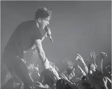  ?? SCOTT GARDNER THE HAMILTON SPECTATOR ?? Arkells' singer Max Kerman interacts with the crowd during a 2017 sold-out show at FirstOntar­io Centre.