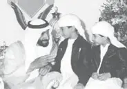  ?? WAM/Gulf News Archives ?? Shaikh Zayed receives greetings from children on UAE National Day in Abu Dhabi in 1992.