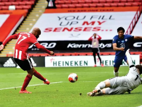  ?? (EPA) ?? David McGoldrick fires Sheffield United in front in the first half