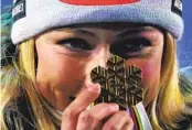  ?? ALESSANDRO TROVATI AP ?? Mikaela Shiffrin shows the gold medal for winning the women’s World Championsh­ip giant slalom.