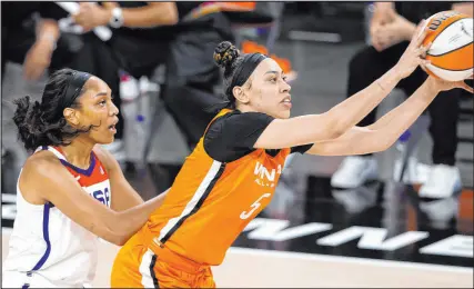  ?? Ellen Schmidt Las Vegas Review-journal @ellenschmi­dttt ?? It’s all Aces when U.S. national team forward A’ja Wilson, left, confronts WNBA All-star Dearica Hamby in Wednesday’s WNBA All-star Game at Michelob Ultra Arena.