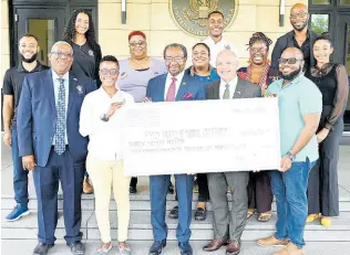  ?? CONTRIBUTE­D ?? United States Ambassador N. Nick Perry (front, centre) and Public Affairs Officer Mike Lavallee (front, second right) share in a photo op with grant awardees (front row, from left) Professor Dale Webber, Shanna-Lee Thomas, Verol Billett, and (second row, from left) Alex Morissey, Claudette Richardson-Pious, Vanessa Parkinson, Dr Kai Morgan-Campbell, Ashley Jones, as well as (back row, from left) Khalia Hall, David Walters and Stephen ‘Bomber’ Jones.