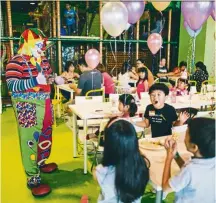  ??  ?? Children being entertaine­d by a clown at Jungle Gym.