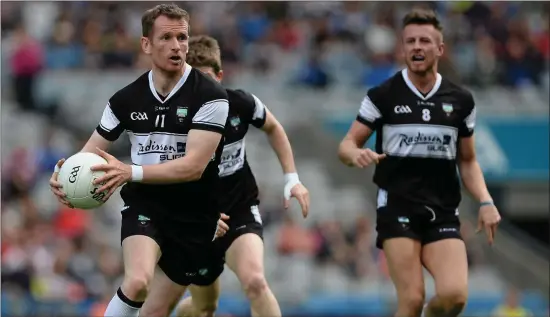  ??  ?? Mark Breheny in action for Sligo with nephew Cian (right) in Croke Park against Tyrone in 2015. INSET: Mark in action against Trevor Giles, Meath, in 2004.