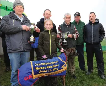  ??  ?? Don McNamara and Martin Galvin presenting the cup to Paudie Lyons and famliy after Paudie’s dog, Wiseguy Shane, won the Donal McNamara Cup at Lixnaw coursing on Sunday.