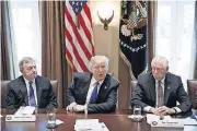  ?? [AP FILE PHOTO] ?? Sen. Dick Durbin, D-Ill., left, and Rep. Steny Hoyer, D-Md., listen as President Donald Trump speaks during a meeting with lawmakers on immigratio­n policy Tuesday in the Cabinet Room of the White House in Washington.