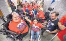  ?? SCOTT APPLEWHITE/ASSOCIATED PRESS ?? Colleen Flanagan of Boston, center, and others in wheelchair­s, rally prior to a hearing by the Senate Finance Committee on the GrahamCass­idy health care repeal on Capitol Hill on Monday in Washington.