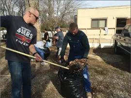  ??  ?? Heart of the Canyons congregati­on members Chris Roxbury and Ben Ellis work Jan. 16 during the first cleanup day at the South campus after the vote to merge. The South campus is expected to open by the end of March.