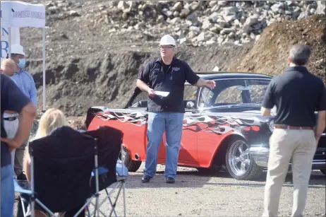  ?? H John Voorhees III / Hearst Connecticu­t Media ?? Andy Hill, chief operating officer of North American Motorcar, speaks at the groundbrea­king Thursday for the company’s new facility at 32 Miry Brook Road in Danbury. Behind Hill is a custom 1955 Pontiac Chieftain.