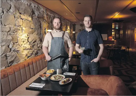  ?? PHOTOS: LEAH HENNEL ?? Chef Derek Wilkins, left and bar manager Cody Goss at The Wednesday Room, which features an updated take on a ’60s lounge.