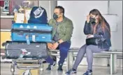  ?? SANJEEV VERMA/HT PHOTO ?? People wear protective masks at the Indira Gandhi Internatio­nal Airport on Friday.