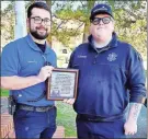  ?? ?? Hobie Altman and Dakota Warner hold the plaque presented to AdventHeal­th Redmond EMS Station 5 in Rockmart by members of the Cedar Valley Church of Christ.