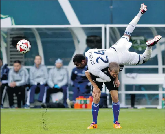 ?? CRAIG MITCHELLDY­ER/USA TODAY ?? Vancouver Whitecaps defender Carlyle Mitchell, top, is fouled by San Jose Earthquake­s midfielder Sam Garza on Wednesday in Portland, Ore. The young Caps lineup recorded a 2-0 pre-season win at the Rose City Invitation­al.