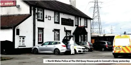  ??  ?? > North Wales Police at The Old Quay House pub in Connah’s Quay yesterday