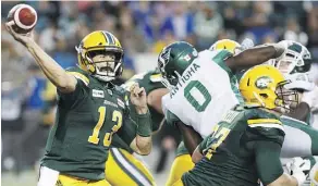  ?? CODIE MCLACHLAN/THE CANADIAN PRESS ?? Eskimos quarterbac­k Mike Reilly, who played with Travis Lulay in Vancouver from 2010-12, will square off against his Lions counterpar­t for just the fourth time since Reilly was traded to Edmonton in 2013.