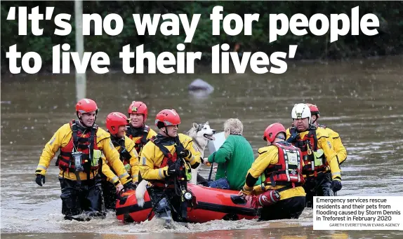  ?? GARETH EVERETT/HUW EVANS AGENCY ?? Emergency services rescue residents and their pets from flooding caused by Storm Dennis in Treforest in February 2020