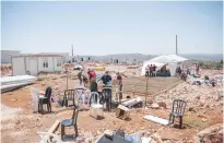  ?? (Flash90) ?? SETTLERS BUILD a structure at the West Bank outpost of Evyatar yesterday.